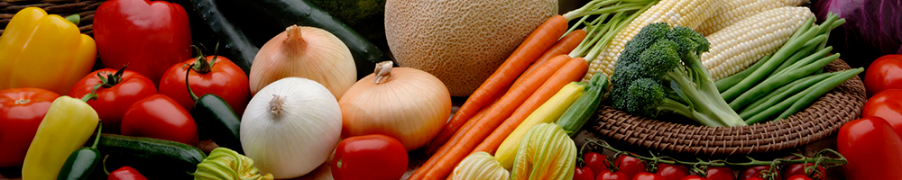A large assortment of vegetables; including peppers, tomatoes, cucumbers, onions, melons, carrots, squash, broccoli, green beans, and sweet corn.